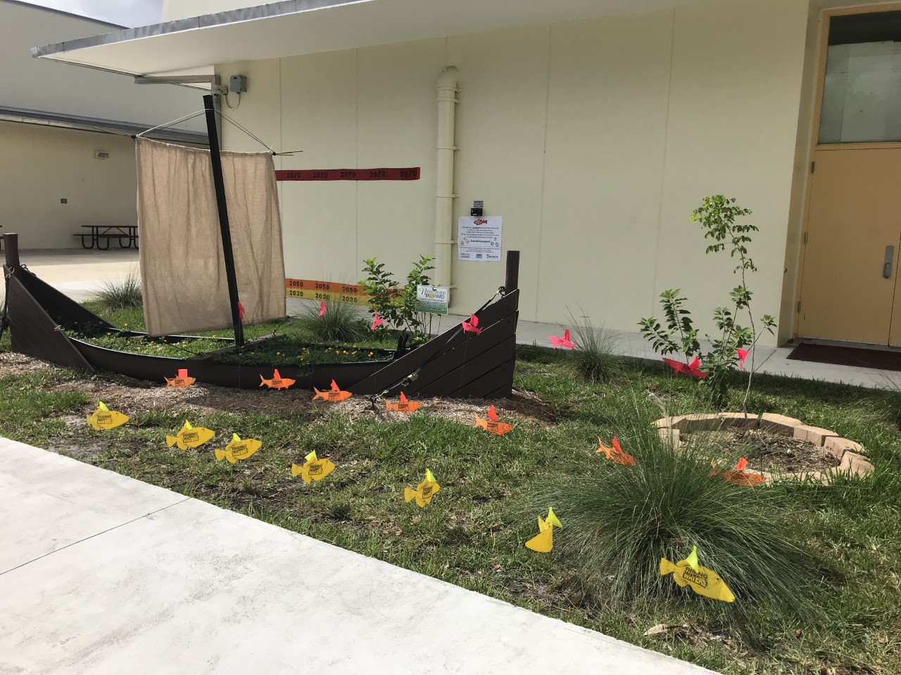 Action fish on front lawn of the school